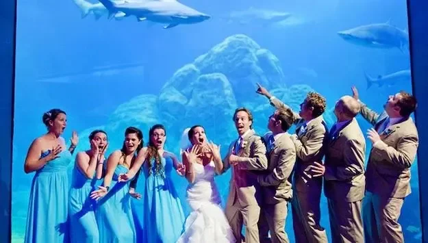 Adventure Aquarium — wedding party beside an aquarium window