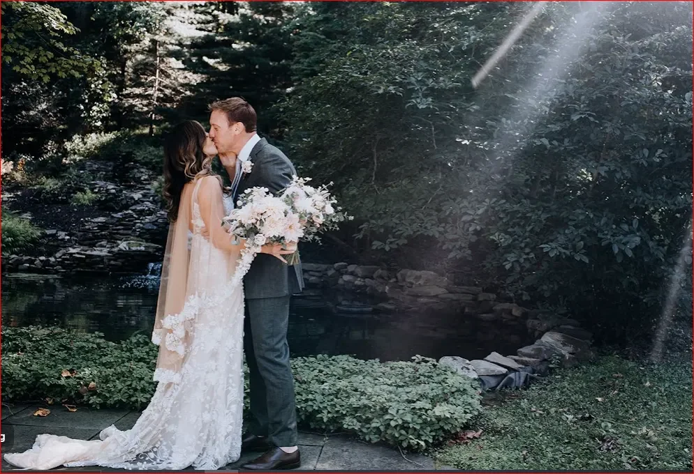 Black Bass Hotel — couple beside the waterfall