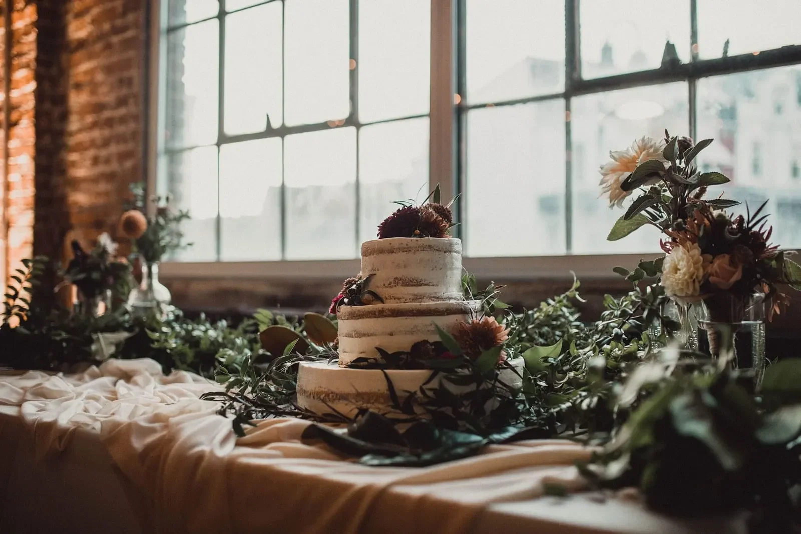 GoggleWorks Center for the Arts — wedding cake beside industrial windows