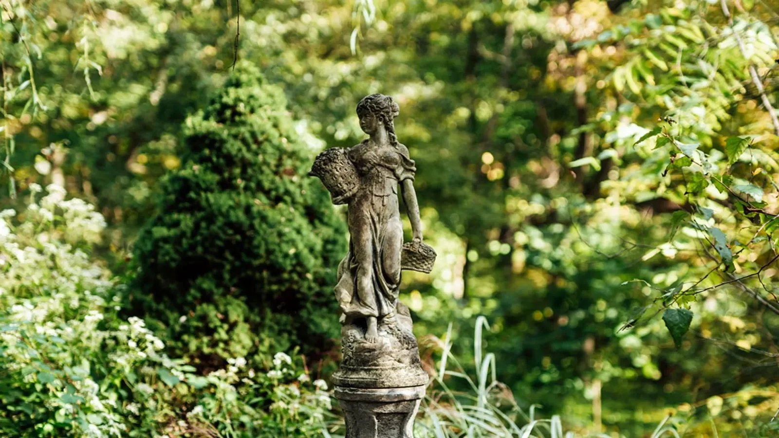 HollyHedge Estate — garden statue and planting