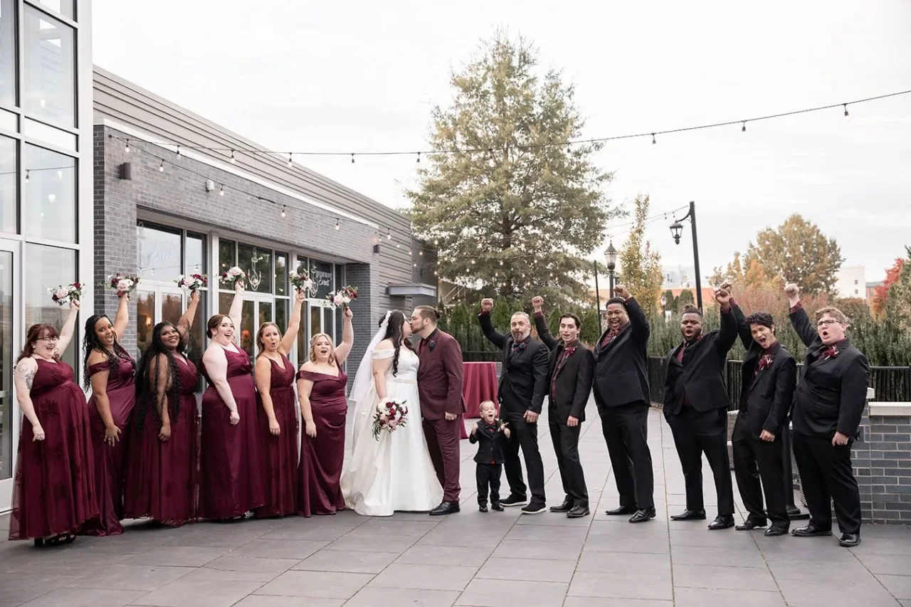 Riverfront Events — wedding party beside the venue terrace